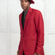 Man in red suit and hat stands against light background in indoor setting Man in red suit and hat stands against light background in indoor setting - PhotoDune Item for Sale