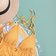 Beach essentials including swimwear, hat, towel, and water bottle. Beach essentials including swimwear, hat, towel, and water bottle. - PhotoDune Item for Sale