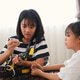 Two Asian girls working together on robotics project at home. Promoting STEM education, coding Two Asian girls working together on robotics project at home. Promoting STEM education, coding - PhotoDune Item for Sale