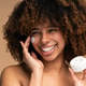 Beautiful black woman applying face luxury sunscreen or moisturizer cream Beautiful black woman applying face luxury sunscreen or moisturizer cream - PhotoDune Item for Sale