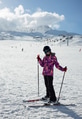 A teenager girl in a ski suit, a helmet and a sun mask stands on skis and with ski poles A teenager girl in a ski suit, a helmet and a sun mask stands on skis and with ski poles - PhotoDune Item for Sale
