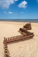 Rusty iron storm and erosion defence barriers on a sandy Norfolk beach on the east coast of England. Rusty iron storm and erosion defence barriers on a sandy Norfolk beach on the east coast of England. - PhotoDune Item for Sale