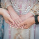 Parents holding bride hands during a wedding ceremony Parents holding bride hands during a wedding ceremony - PhotoDune Item for Sale