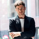 Smart handsome business man standing while crossing arms looking at camera in a modern startup. Smart handsome business man standing while crossing arms looking at camera in a modern startup. - PhotoDune Item for Sale