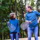 Father teaching son to play badminton in the park. Weekend for two. Father teaching son to play badminton in the park. Weekend for two. - PhotoDune Item for Sale