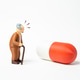 An elderly man surprised by a large pill highlights complex treatment An elderly man surprised by a large pill highlights complex treatment - PhotoDune Item for Sale