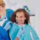 Cute little girl smiling during dental visit Cute little girl smiling during dental visit - PhotoDune Item for Sale