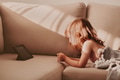 Cute toddler girl on coach, kids using technologies, child watchimg certoons, addiction from gadgets Cute toddler girl on coach, kids using technologies, child watchimg certoons, addiction from gadgets - PhotoDune Item for Sale