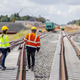 Engineers inspect the newly constructed railway tracks. Engineers inspect the newly constructed railway tracks. - PhotoDune Item for Sale