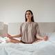 Young woman meditating in bed at home, mindfulness and mental health concept Young woman meditating in bed at home, mindfulness and mental health concept - PhotoDune Item for Sale