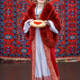 Woman holding a plate of pancakes with red caviar. Traditional thin Russian pancakes on a plate Woman holding a plate of pancakes with red caviar. Traditional thin Russian pancakes on a plate - PhotoDune Item for Sale