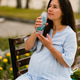 Pregnant woman drinking water from reusable glass bottle outdoor.Hydration during pregnancy concept Pregnant woman drinking water from reusable glass bottle outdoor.Hydration during pregnancy concept - PhotoDune Item for Sale