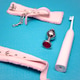 Sex toys on a blue background. Anal plug with pink handcuffs and electric toothbrush. Household appl Sex toys on a blue background. Anal plug with pink handcuffs and electric toothbrush. Household appl - PhotoDune Item for Sale