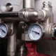 Complex residential heating manifold system with valves, gauges, and piping network Complex residential heating manifold system with valves, gauges, and piping network - PhotoDune Item for Sale