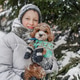 Holding maltipoo dog near snowy spruce, teen boy hugs furry pet, smiles during winter walk Holding maltipoo dog near snowy spruce, teen boy hugs furry pet, smiles during winter walk - PhotoDune Item for Sale
