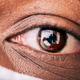 Close up of African American man’s eye wearing mask Close up of African American man’s eye wearing mask - PhotoDune Item for Sale