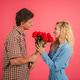 Joyful couple sharing a romantic moment while exchanging beautiful roses on a lovely day together Joyful couple sharing a romantic moment while exchanging beautiful roses on a lovely day together - PhotoDune Item for Sale