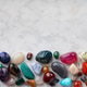 ow of Colorful Polished Gemstones on Marble Surface ow of Colorful Polished Gemstones on Marble Surface - PhotoDune Item for Sale