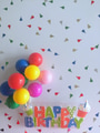 Flat lay of a Happy Birthday sign with balloons and confetti. Background with copy space. Flat lay of a Happy Birthday sign with balloons and confetti. Background with copy space. - PhotoDune Item for Sale