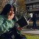 young woman reading a book smiling happily with one hand on her mouth young woman reading a book smiling happily with one hand on her mouth - PhotoDune Item for Sale