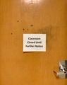 “Classroom close until farther notice” sign at college classroom door due to Corona virus. “Classroom close until farther notice” sign at college classroom door due to Corona virus. - PhotoDune Item for Sale