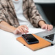 Close up of a man hands touching tapping on laptop and looking at phone atop book sits at cafe table Close up of a man hands touching tapping on laptop and looking at phone atop book sits at cafe table - PhotoDune Item for Sale