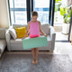 Young girl preparing for yoga session at home in bright living room Young girl preparing for yoga session at home in bright living room - PhotoDune Item for Sale