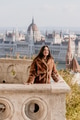 Portrait of beautiful young woman on balcony overlooking Hungarian Parliament in Budapest, Hungary Portrait of beautiful young woman on balcony overlooking Hungarian Parliament in Budapest, Hungary - PhotoDune Item for Sale