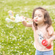 a little Armenian girl of three years blows soap bubbles on a flowering meadow a little Armenian girl of three years blows soap bubbles on a flowering meadow - PhotoDune Item for Sale