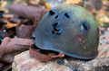 Old Soviet military steel helmet on a stone Old Soviet military steel helmet on a stone - PhotoDune Item for Sale