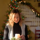 Woman decorating home for Christmas Woman decorating home for Christmas - PhotoDune Item for Sale