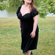 Confident woman in black dress by lakeside Confident woman in black dress by lakeside - PhotoDune Item for Sale