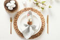 Spring Easter festive table setting with organic brown egg, white bunny and blossom flowers. Spring Easter festive table setting with organic brown egg, white bunny and blossom flowers. - PhotoDune Item for Sale