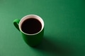 Coffee in green cup for St Patricks Day on green background. Coffee in green cup for St Patricks Day on green background. - PhotoDune Item for Sale