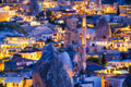 Goreme, Cappadocia, Turkey. View of the evening city from the mountain. Bright evening city. Goreme, Cappadocia, Turkey. View of the evening city from the mountain. Bright evening city. - PhotoDune Item for Sale