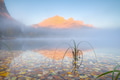 Foggy mountain landscape at dawn. Sunbeams in a valley. Banff National Park, Alberta, Canada. Foggy mountain landscape at dawn. Sunbeams in a valley. Banff National Park, Alberta, Canada. - PhotoDune Item for Sale