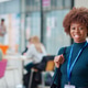 Portrait Of Smiling Female College Student In Busy Communal Campus Building Portrait Of Smiling Female College Student In Busy Communal Campus Building - PhotoDune Item for Sale