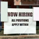 “Now Hiring All positions Apply Within” sign displayed at business’s ...