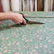 senior woman working in atelier shop with rolls of fabrics. Cutting fabrics. Small business senior woman working in atelier shop with rolls of fabrics. Cutting fabrics. Small business - PhotoDune Item for Sale
