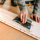 close up of worker hands, craftsman using glue and trowel close up of worker hands, craftsman using glue and trowel - PhotoDune Item for Sale