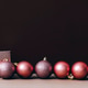 Pink christmas balls on brown and beige wall. Elegant Christmas decoration background. Pink christmas balls on brown and beige wall. Elegant Christmas decoration background. - PhotoDune Item for Sale