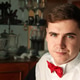 Portrait of a young man in a white shirt and red bow tie. Handsome male Man 25s years old Portrait of a young man in a white shirt and red bow tie. Handsome male Man 25s years old - PhotoDune Item for Sale
