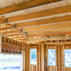 Construction site interior shows wooden beams framed walls of new home Construction site interior shows wooden beams framed walls of new home - PhotoDune Item for Sale