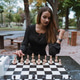 Young woman playing chess Young woman playing chess - PhotoDune Item for Sale