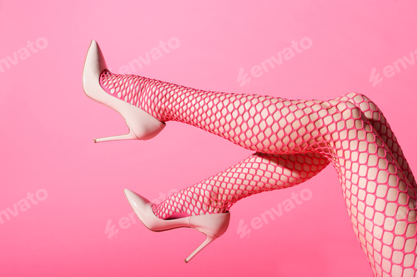 Female legs raised in sexy pink fishnets and high heels Stock Photo by Photology75 Female legs raised in sexy pink fishnets and high heels Stock Photo by Photology75