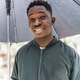 Smiling Young African Man Holding Umbrella on Bright Autumn Day Smiling Young African Man Holding Umbrella on Bright Autumn Day - PhotoDune Item for Sale