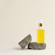bottle with yellow cosmetic products placed on a piece of natural stone bottle with yellow cosmetic products placed on a piece of natural stone - PhotoDune Item for Sale