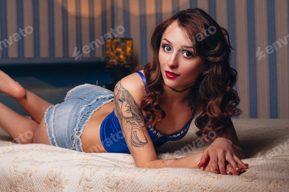 Beautiful sexy naked girl in underwear with a belt on a white bed. Erotic photoshoot charming Stock Photo by IvaFoto Beautiful sexy naked girl in underwear with a belt on a white bed. Erotic photoshoot charming Stock Photo by IvaFoto