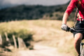 Mountain bike rider on country road, track trail in inspirationa Mountain bike rider on country road, track trail in inspirationa - PhotoDune Item for Sale