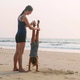 Young sporty mother train little girl doing handstand position Young sporty mother train little girl doing handstand position - PhotoDune Item for Sale